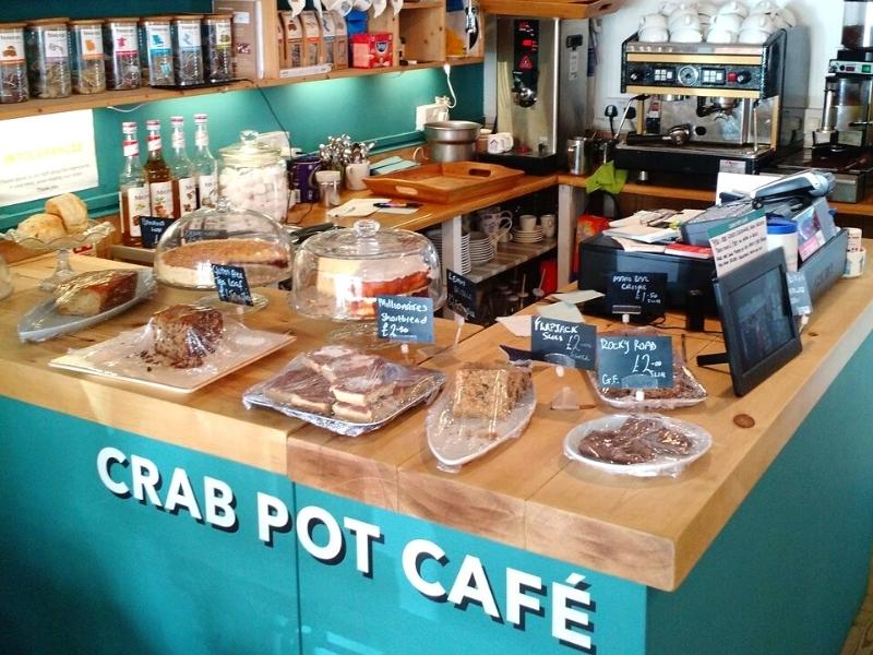 The Crab Pot Café Cromer counter with cakes, bottles and coffee machine on display