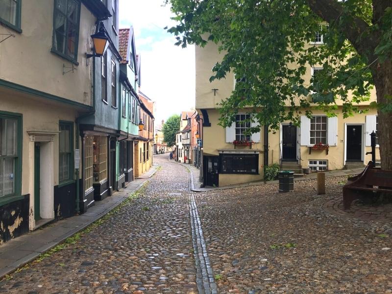 Colourful houses along cobbled Elm Hill Norwich