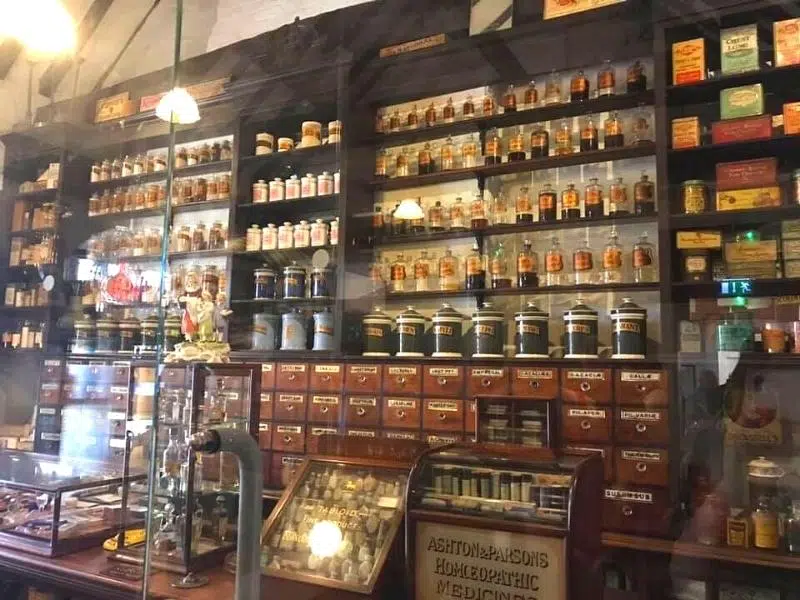 Bottles and jars on shelves in an old fashioned shop