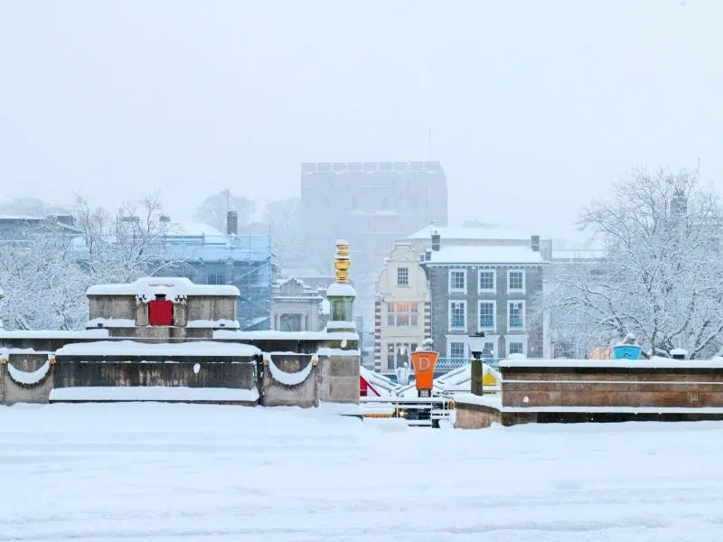 Norwich market and castle shrouded in snow