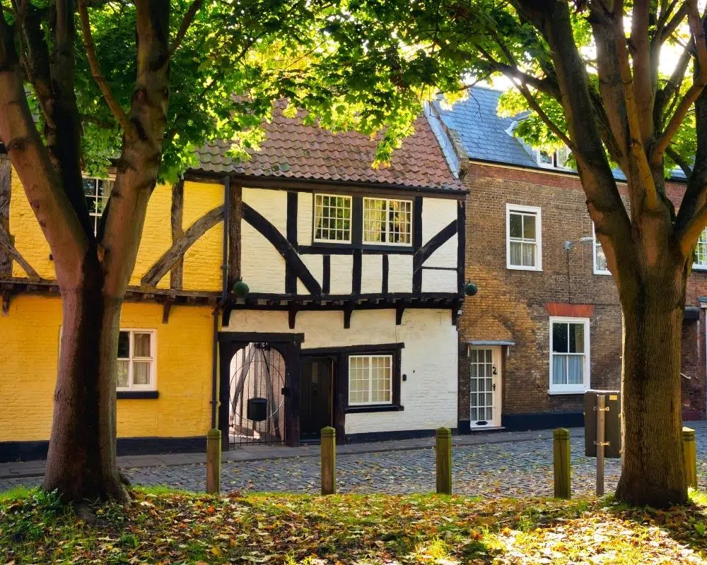 old half-timber houses on a cobbled street in Norfolk