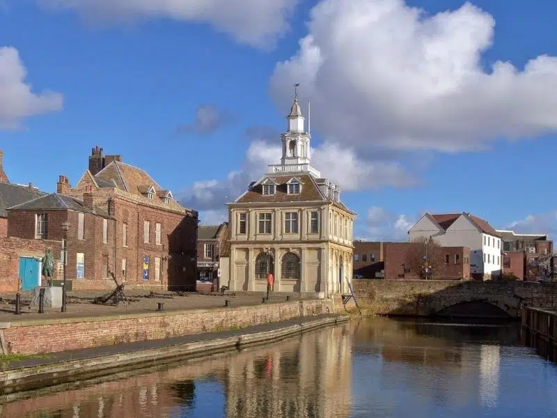 square customs house building on a small quay