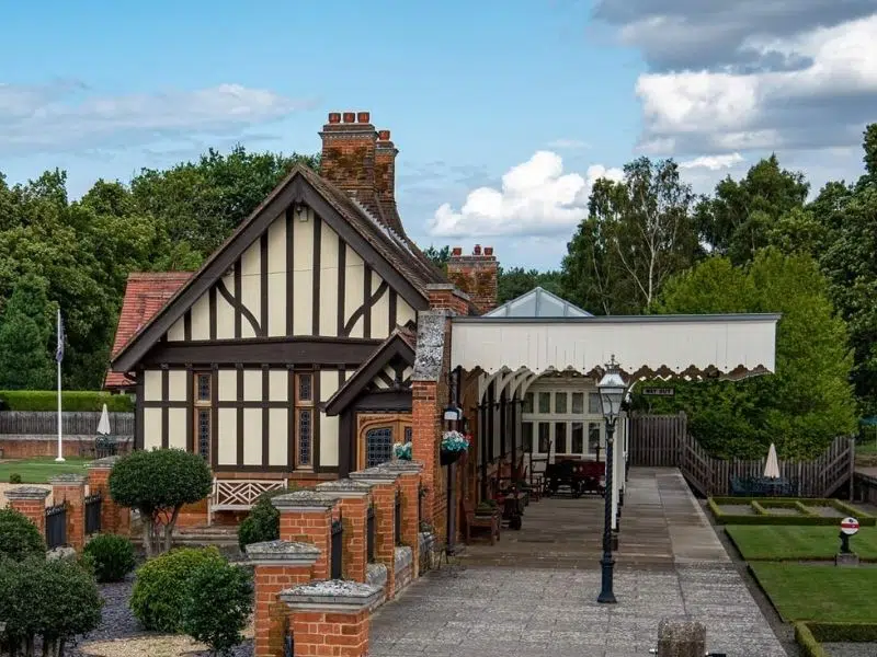 Disused station attached to a small timbered and red brick house