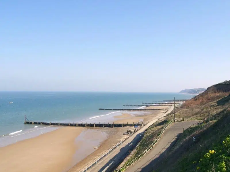 Sandy Norfolk beach with wooden groynes 