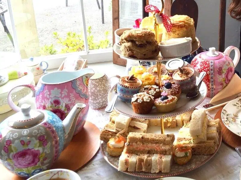 Table laid for afternoon tea, with cake stand