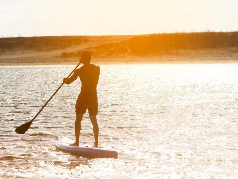 Man on a stand up paddle board Norfolk