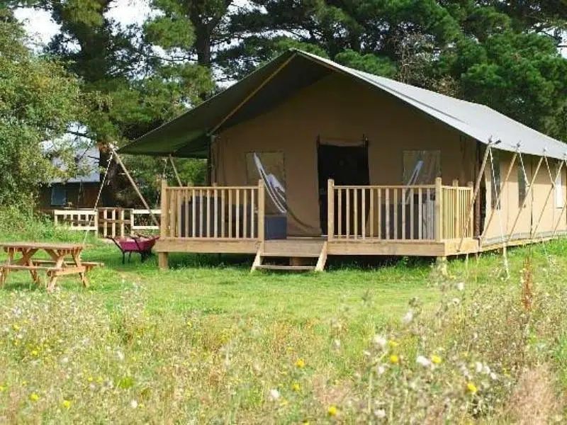 safari tent with decking and picnic table
