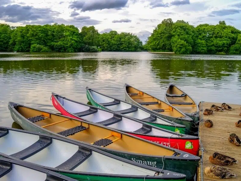 Colourful open canoes moored at Salhouse Broad