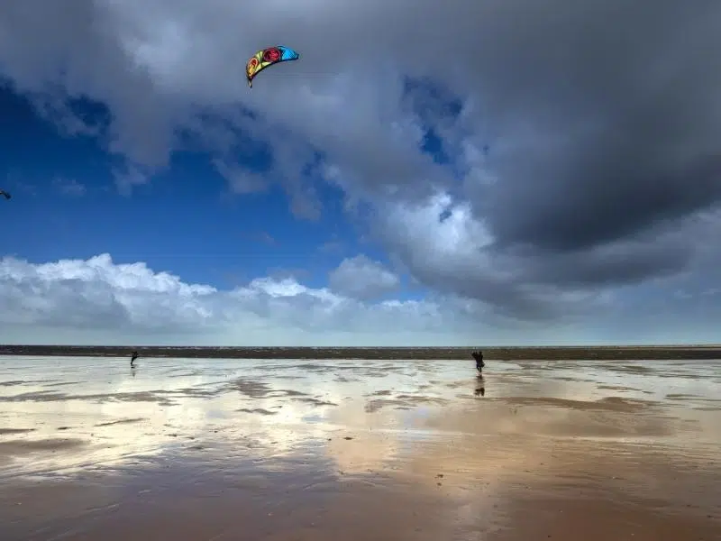 kite surfing at Brancaster Beach on a cloudy day