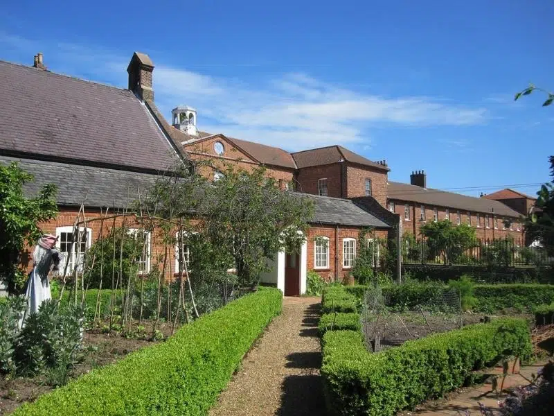 Old red brick workhouse with a kitchen garden
