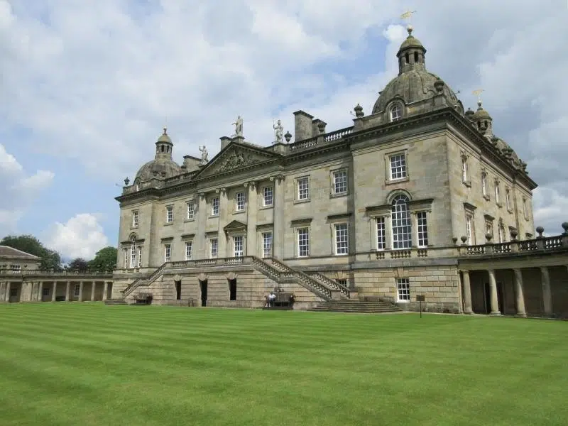 Pale stone stately home with many windows