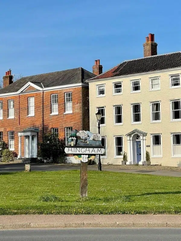 Hingham town sign on the green, backed by Georgian buildings