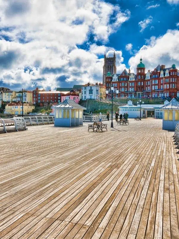 Pier and colourful Cromer town with red brick buildings