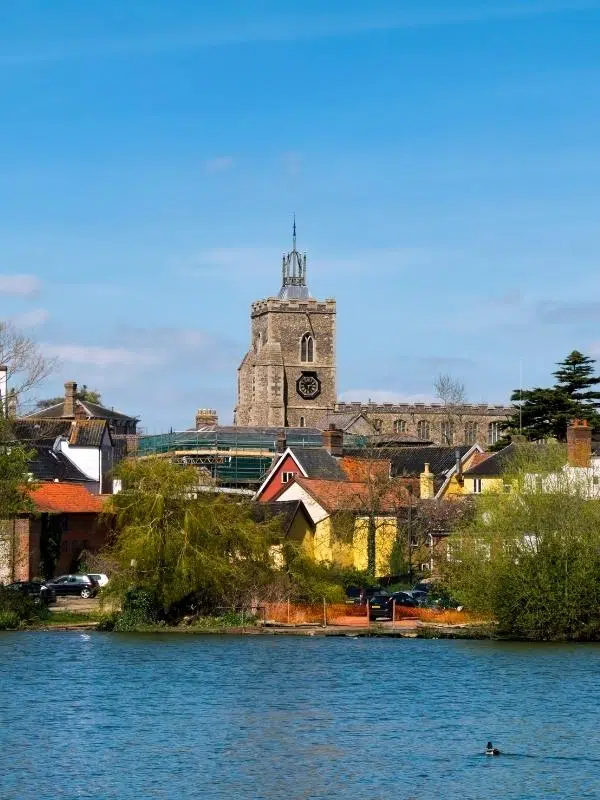 Diss Mere on a sunny day with the town and church behind