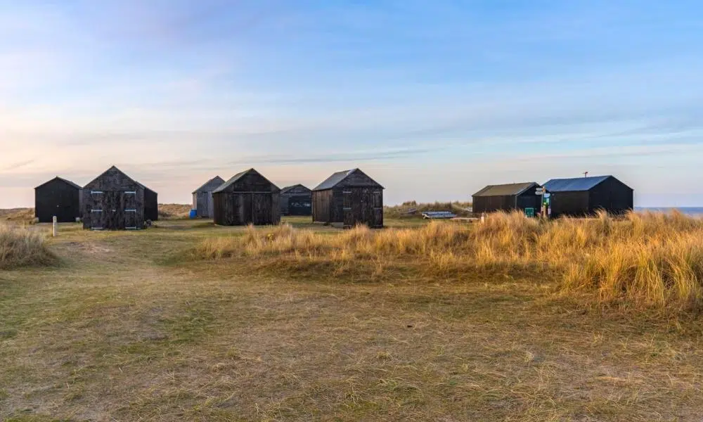 Black fishermans huts near Winterton beach car park