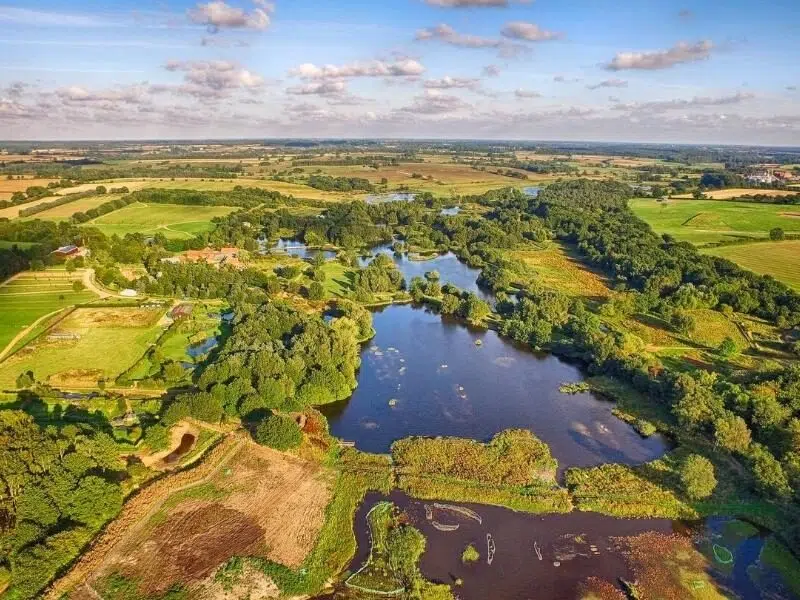 nature reserve with water and fields pictured from above