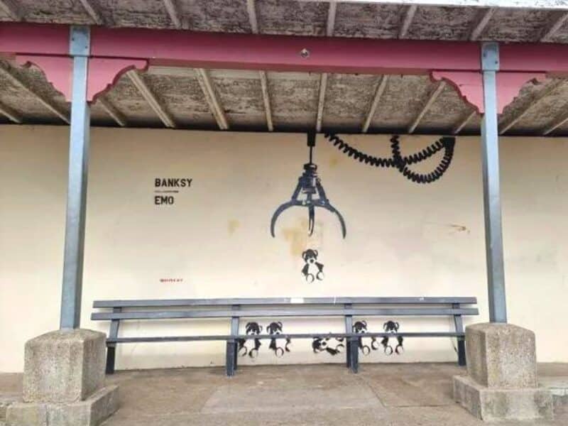 Banksy artwork in a seaside shelter