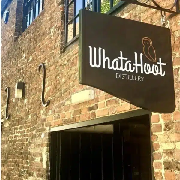 distillery sign on the outside of old brick building