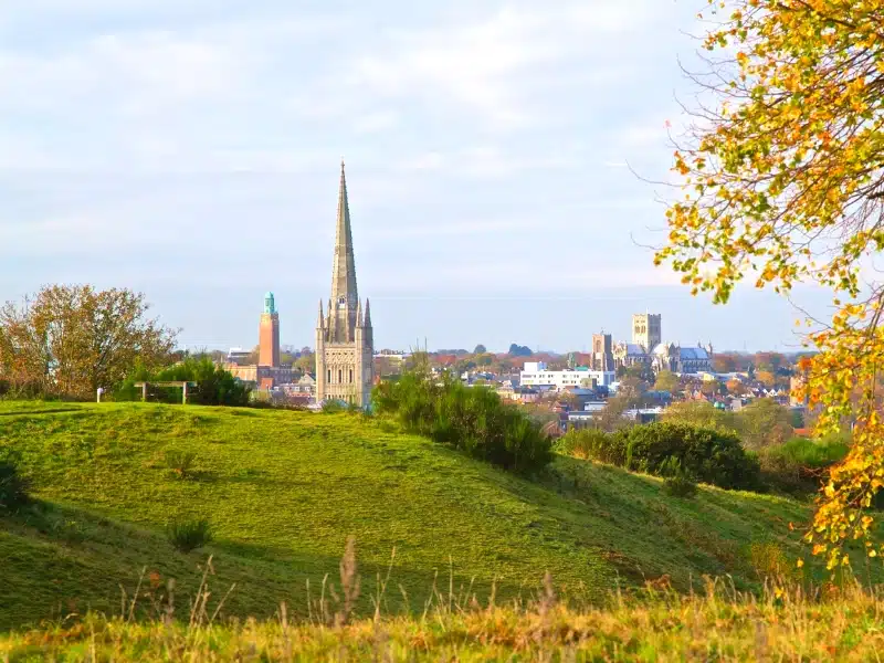 Norwich cathedral spire, the Cathedral of St John the Baptist and Norwich city hall on the skyline 
